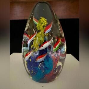 Vintage solid glass blown oval shaped sculpture with vibrant swimming fish